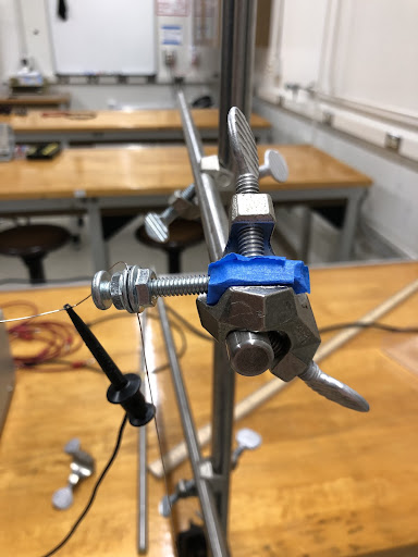 _wire_wrapped_around_screw_with_flange_nuts_.jpeg