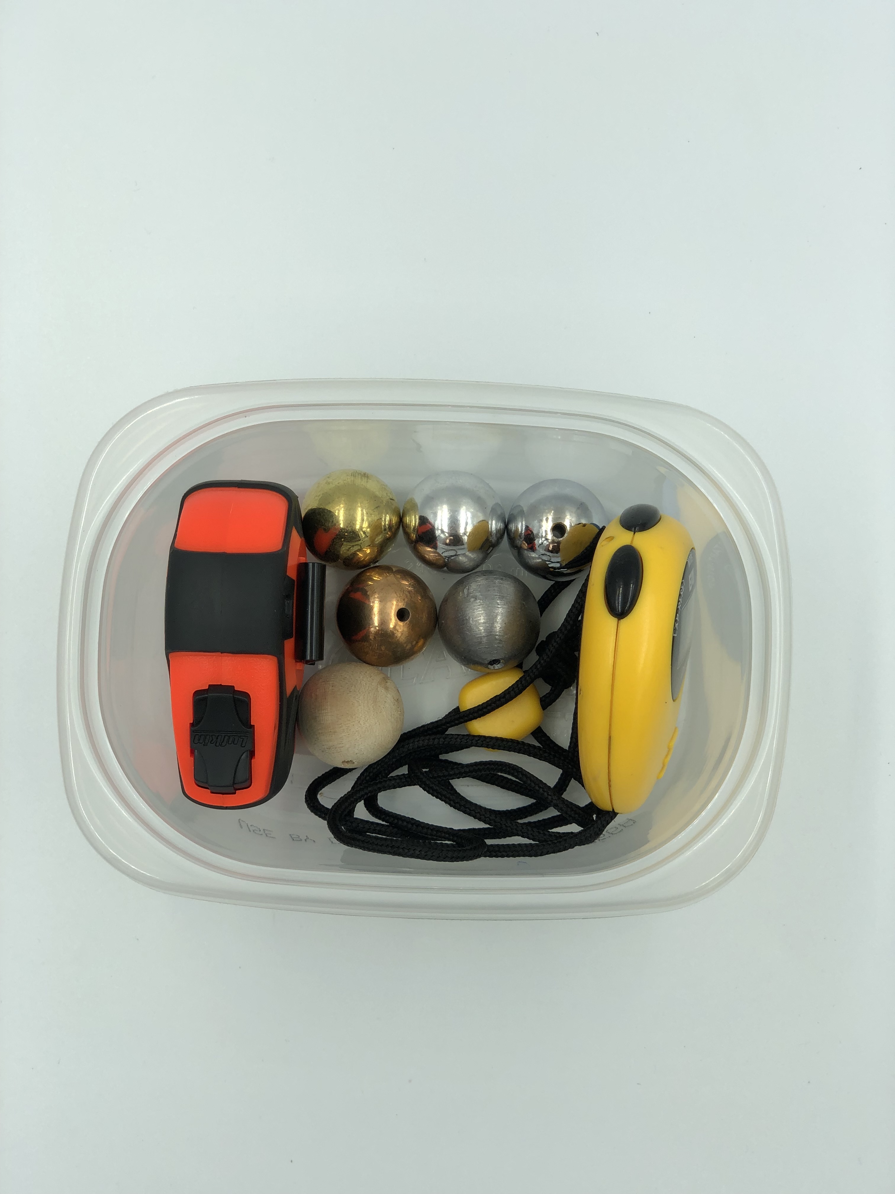 container_with_bobs_stopwatch_and_tape_measure.jpg